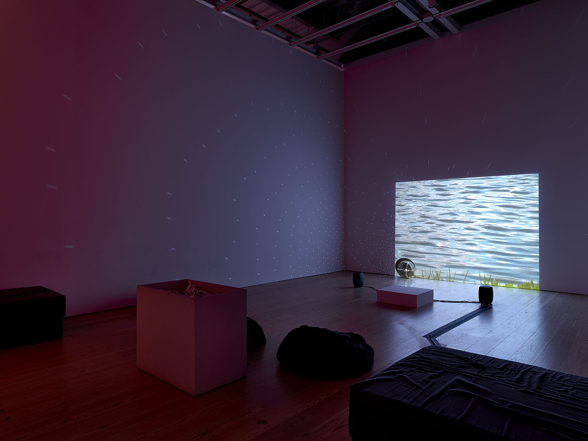 A video installation showing a body of water.