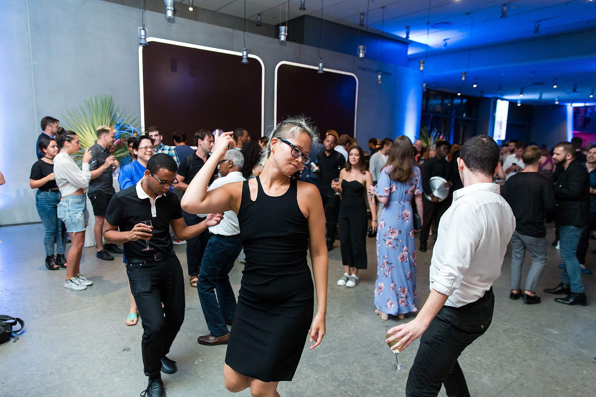 People dancing in the Whitney's lobby.