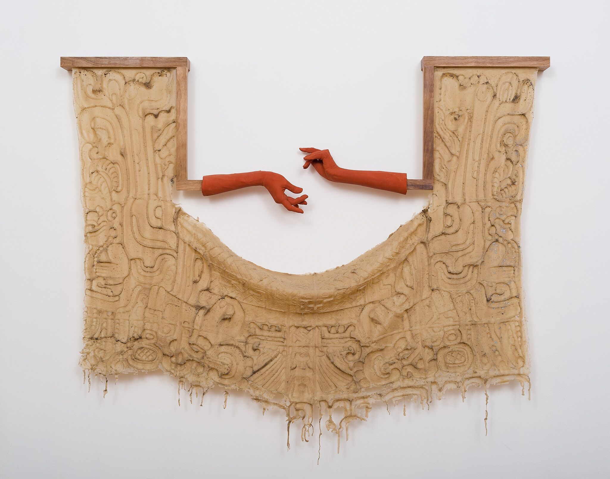 Two hands outstretched in a sculpture.