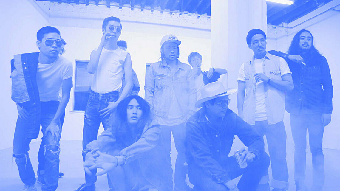 A group of men posing. 