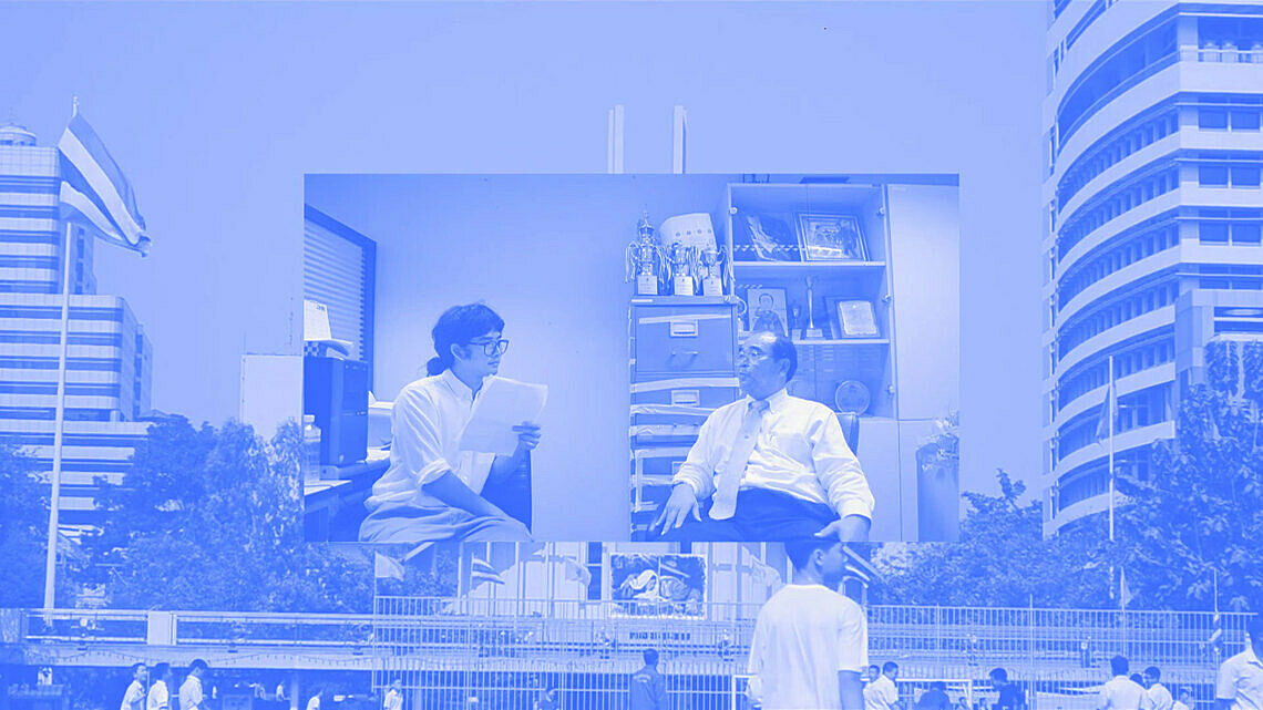 A billboard in the streets of two people talking. 