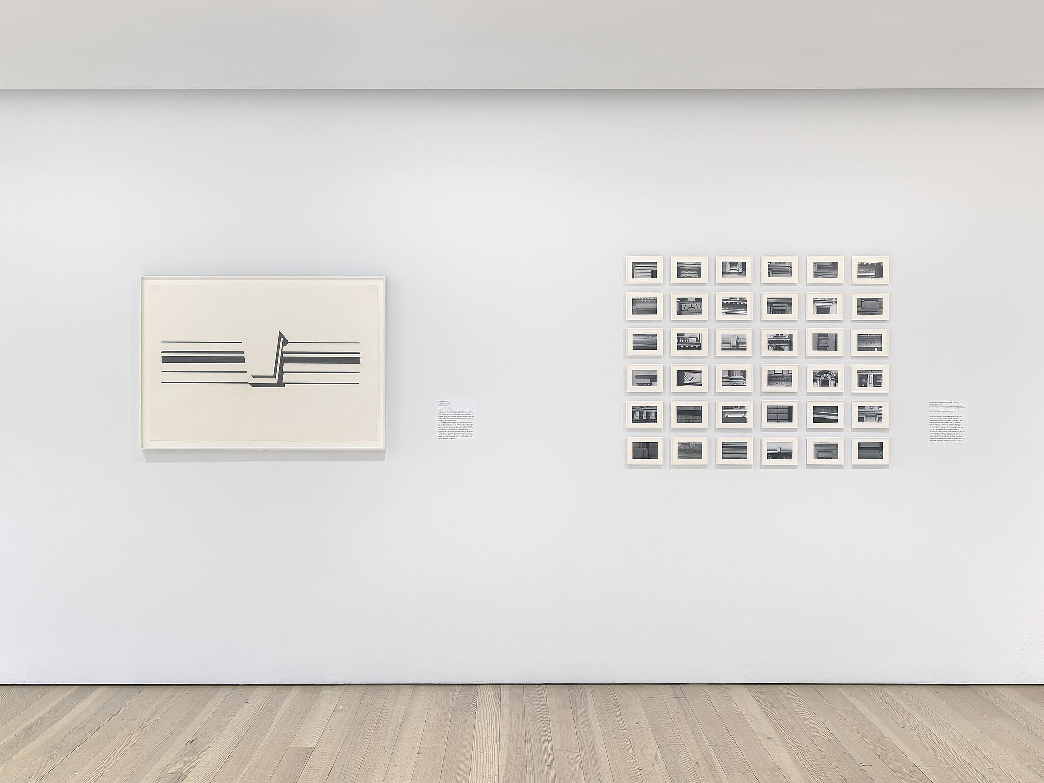 A photo of the Whitney galleries with various artworks on the walls.