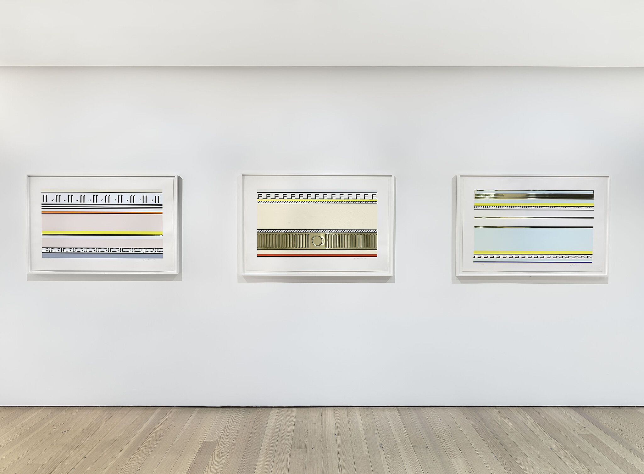 A photo of a Whitney gallery with various artworks on the wall.