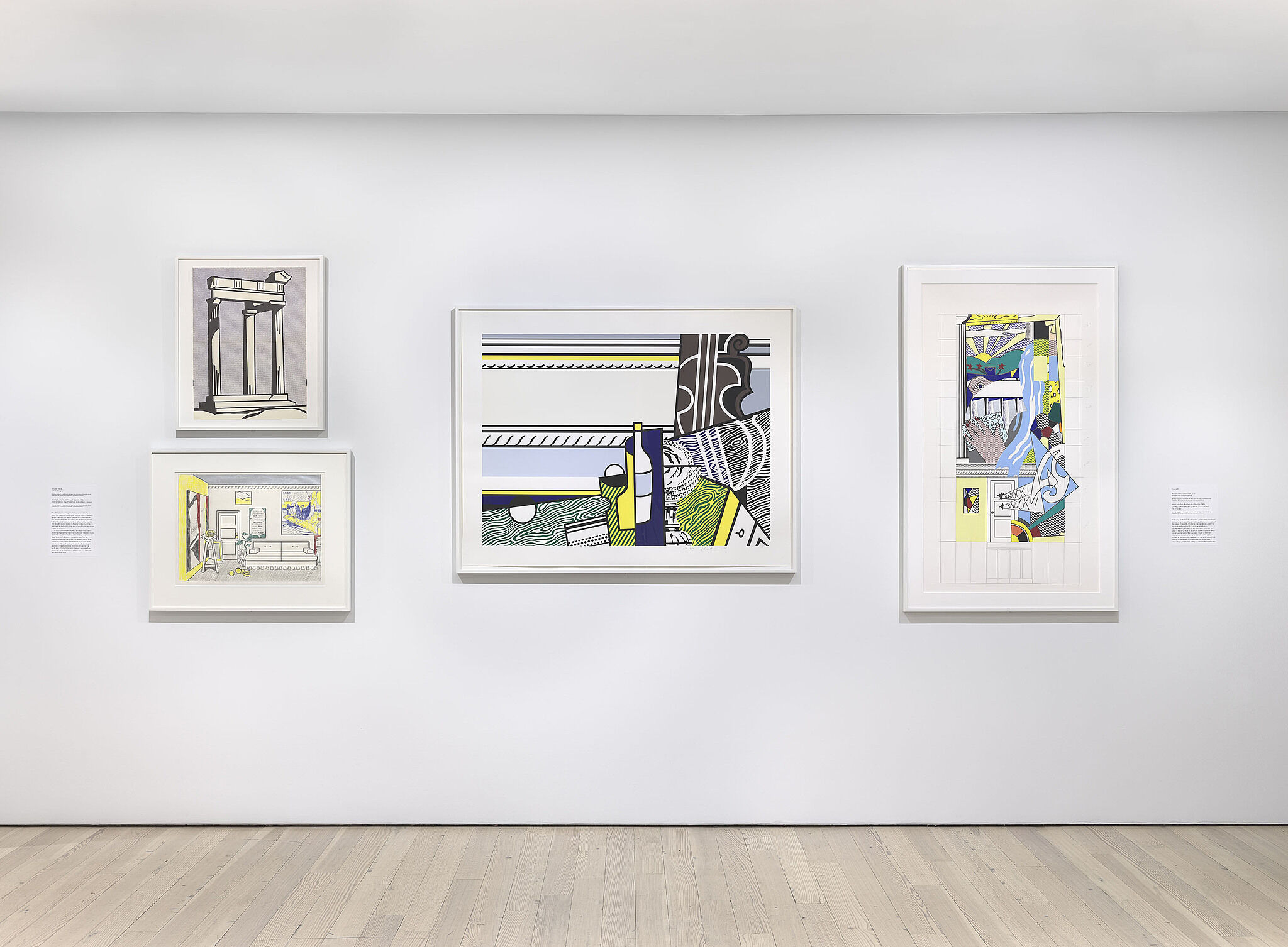 A photo of a Whitney gallery with various artworks on the wall.