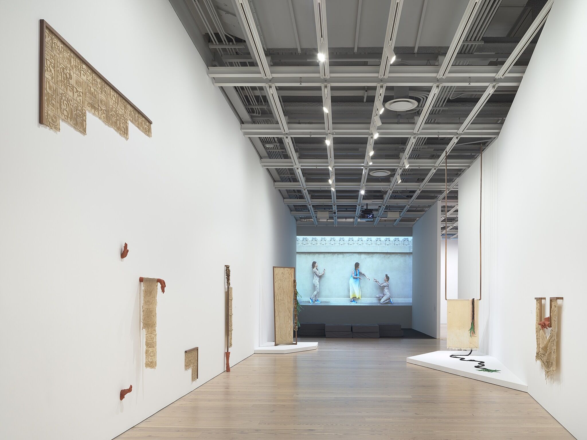 A photo of the Whitney galleries with various artworks.