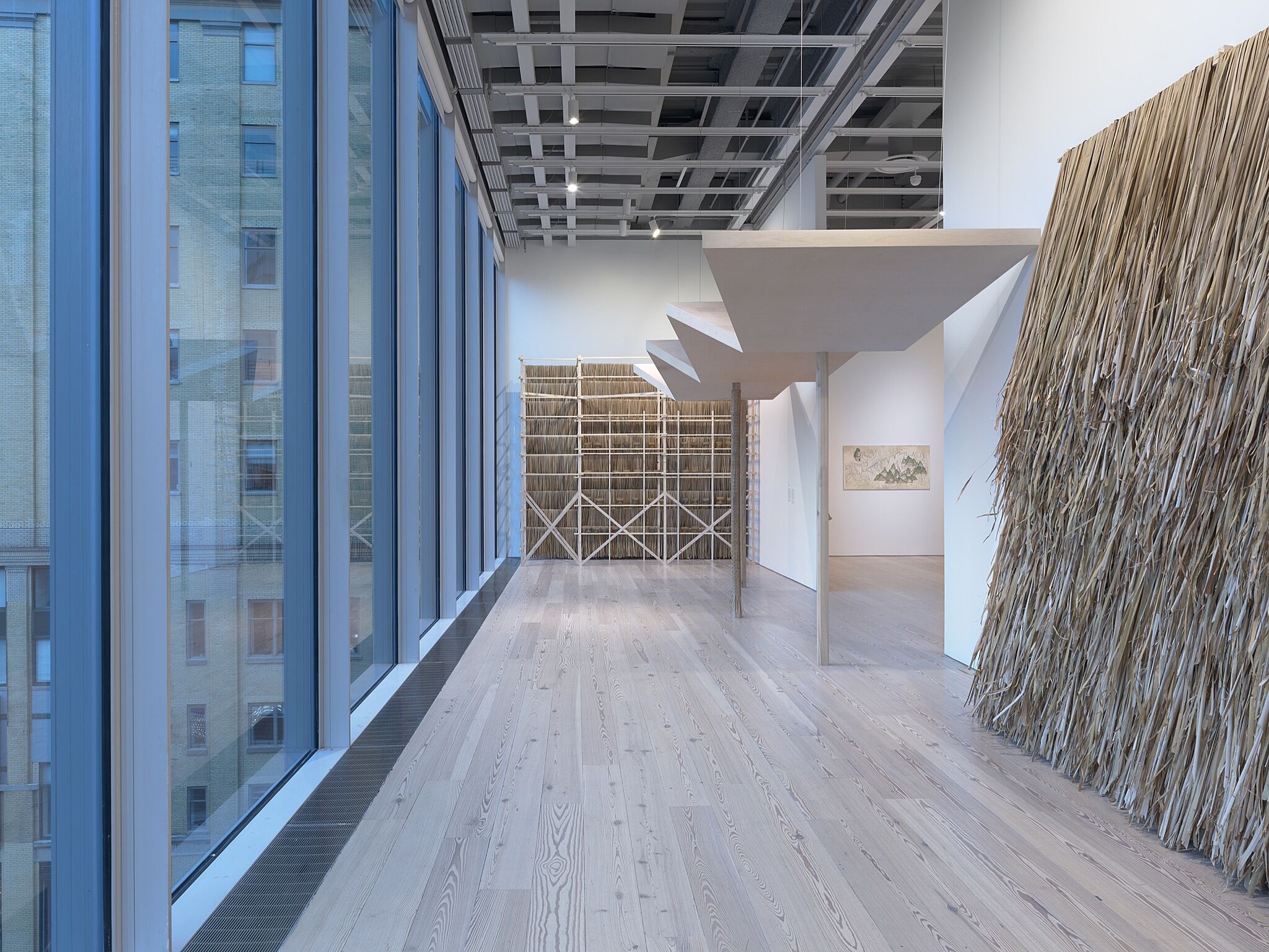 A photo of the Whitney galleries with various artworks.