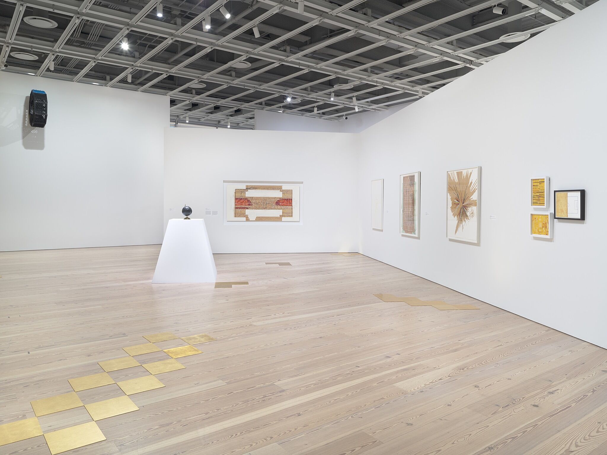 A photo of the Whitney galleries with various artworks.