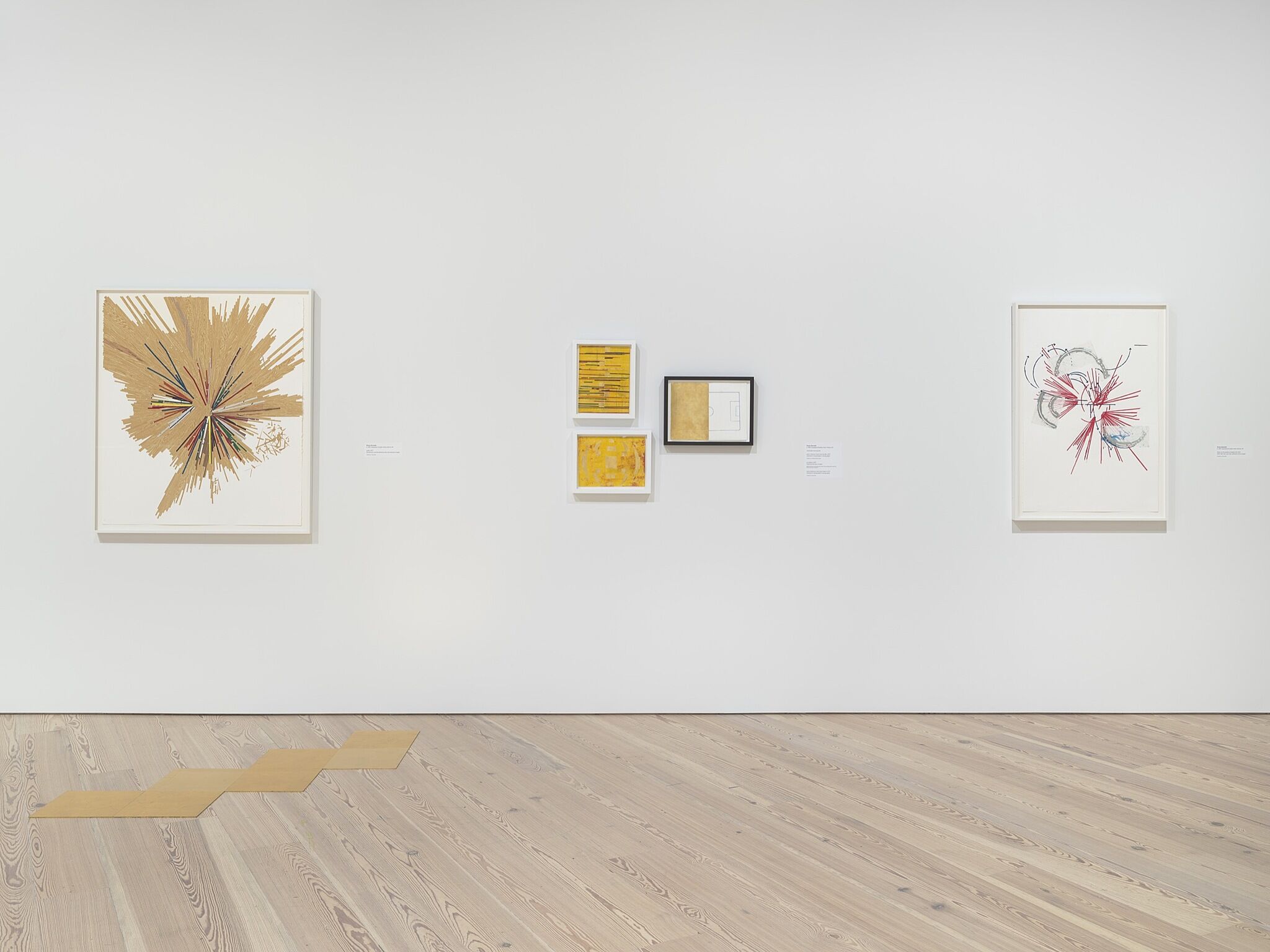 A photo of the Whitney galleries with various artworks.