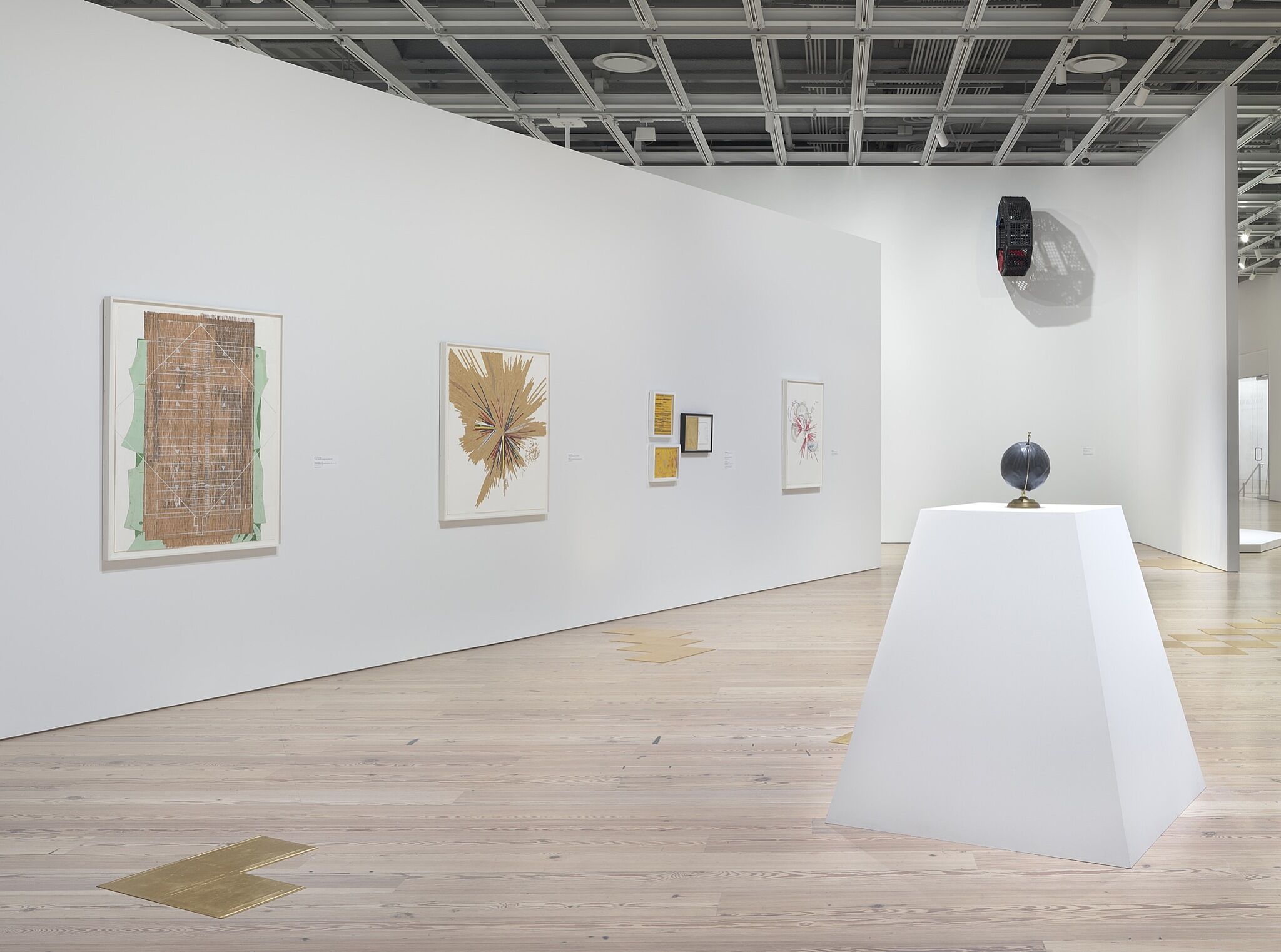 A photo of the Whitney galleries with various artworks.