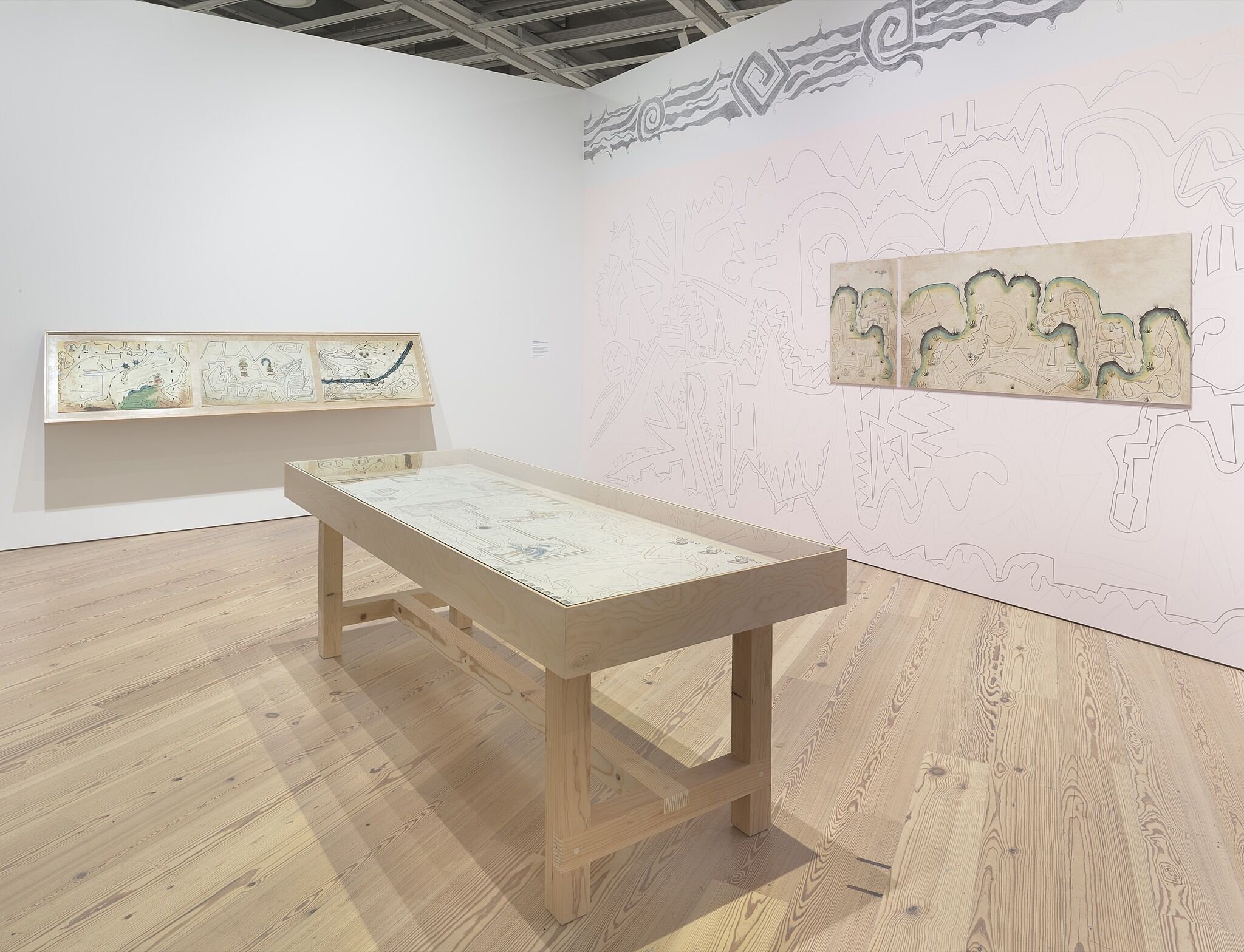 A photo of the Whitney galleries with various artworks.