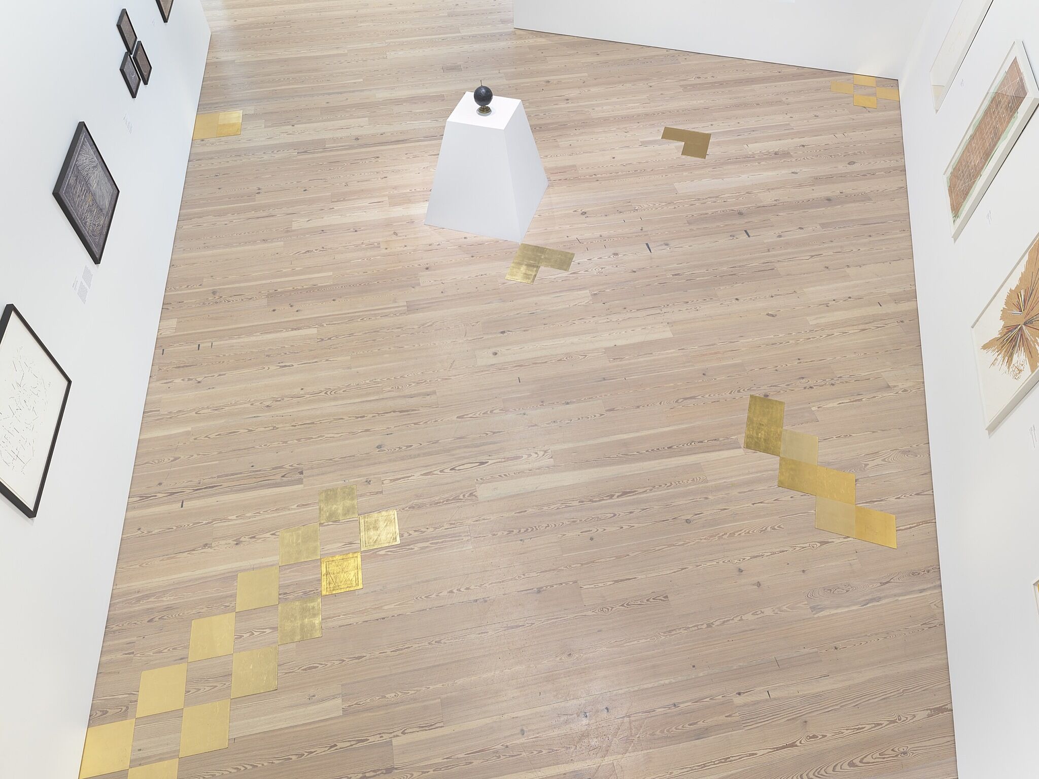 A photo of the Whitney galleries with various artworks.