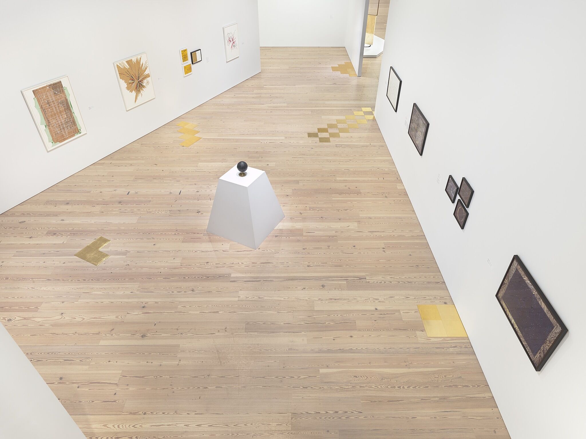 A photo of the Whitney galleries with various artworks.