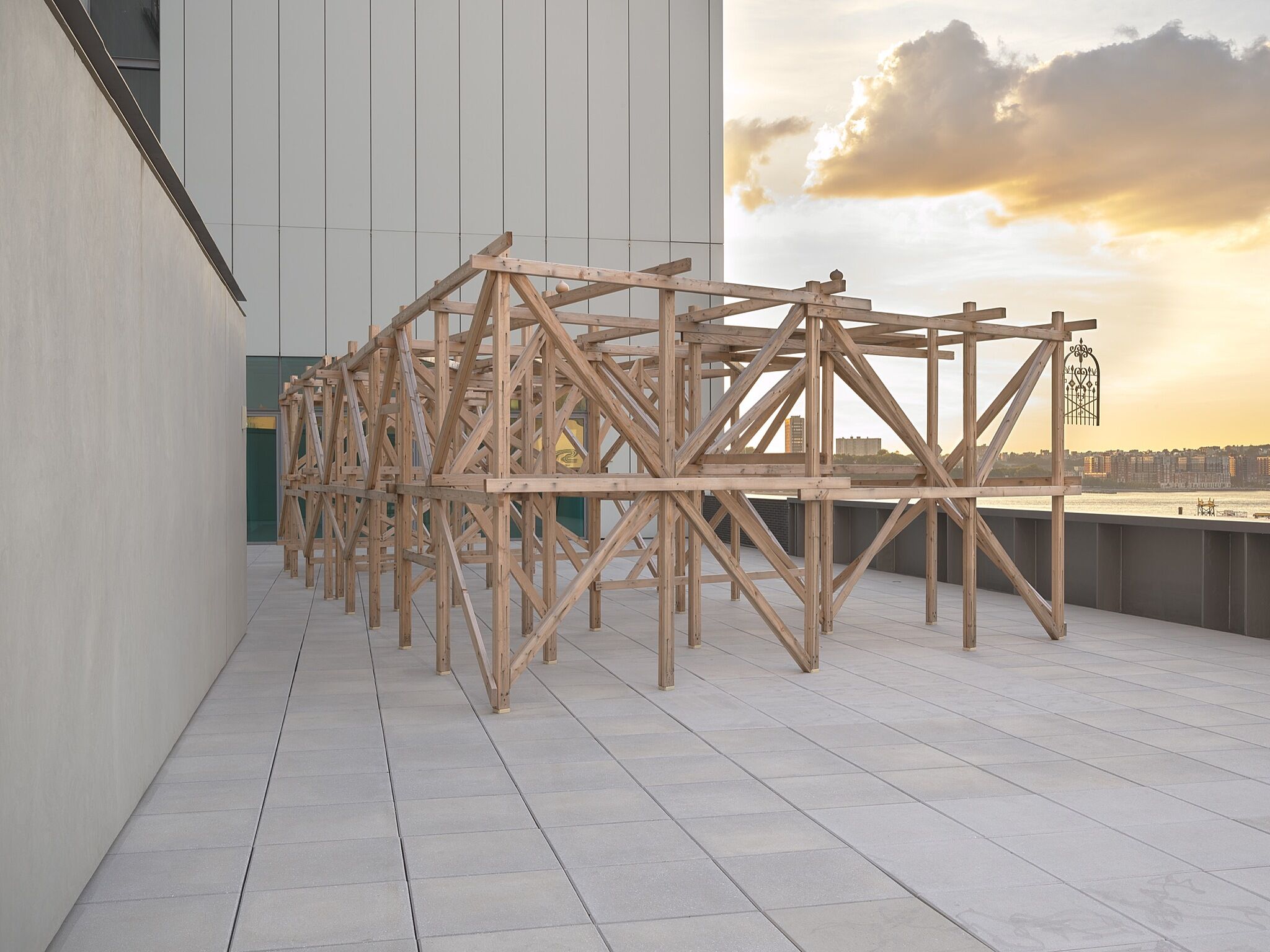 An outdoor wood and steel sculpture.