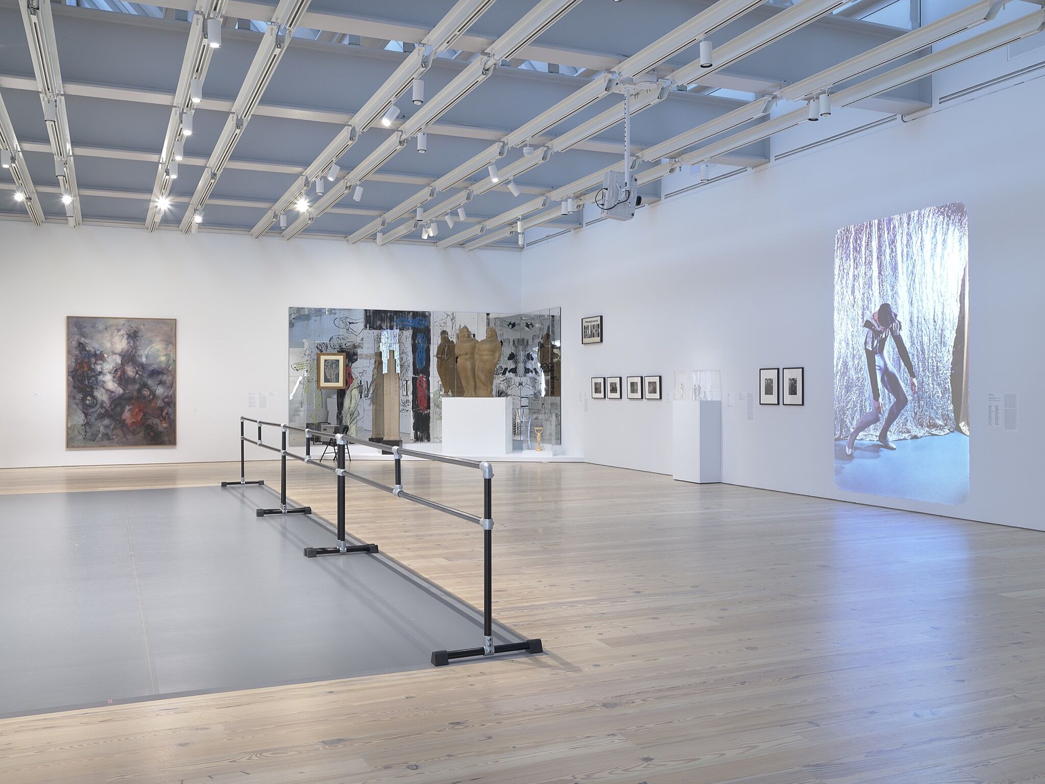 A photo of the Whitney galleries with various artworks.