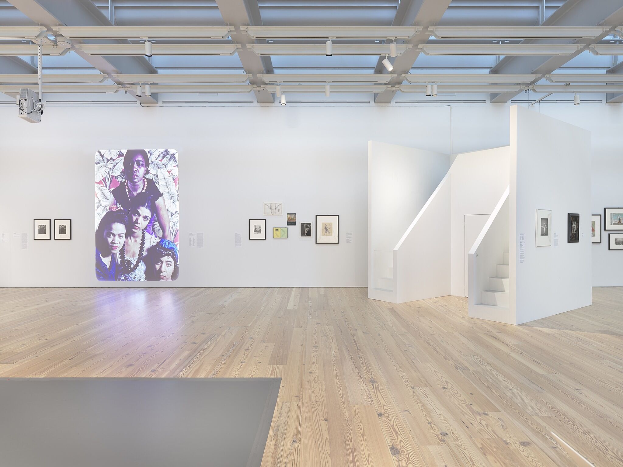 A photo of the Whitney galleries with various artworks.