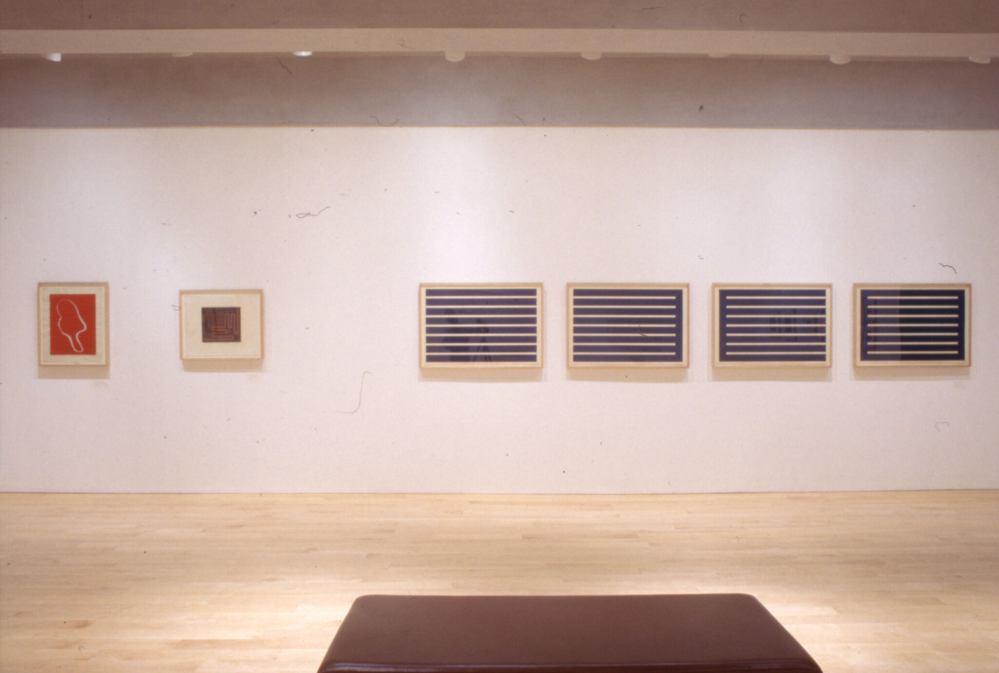 Abstract prints displayed in a gallery.